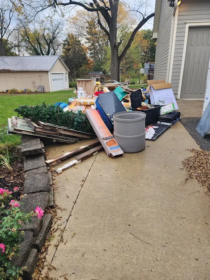 Dumpster being loaded with debris for 10 Yard Dumpster Rental in Hoopeston